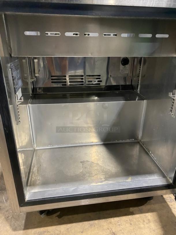 Turbo Air MST-28 commercial refrigerated prep table, stainless steel, single door, bain marie style, on casters.