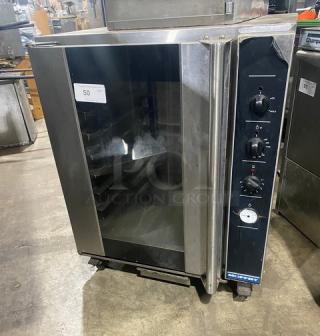 Moffat P8M Turbofan Series stainless steel electric holding cabinet, 8-pan capacity, insulated, with built-in pan slide, on casters.