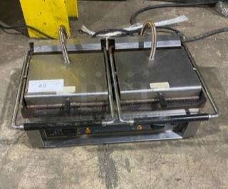 Equipex MAJESTIC stainless steel dual Panini press grill with grooved grates. Electric, model MAJESTIC, SN: 102085.