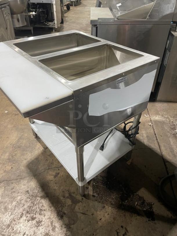 Prepline stainless steel 2-well hot food/steam table, model EST302O, with cutting board, single undershelf, and legs.