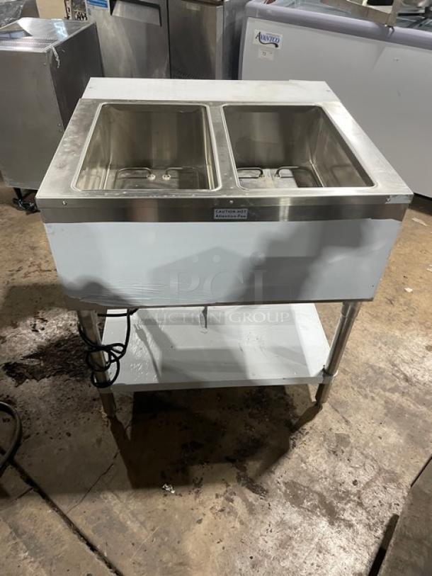 Prepline EST302O commercial stainless steel 2-well steam table with cutting board and undershelf, model EST302O, 120V, on legs.