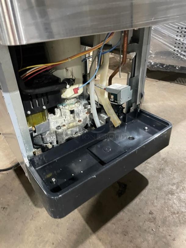 Hoshizaki Opti-Serve DCM-270BAH-OS ice maker interior showing components and wiring, stainless steel, electric-powered.