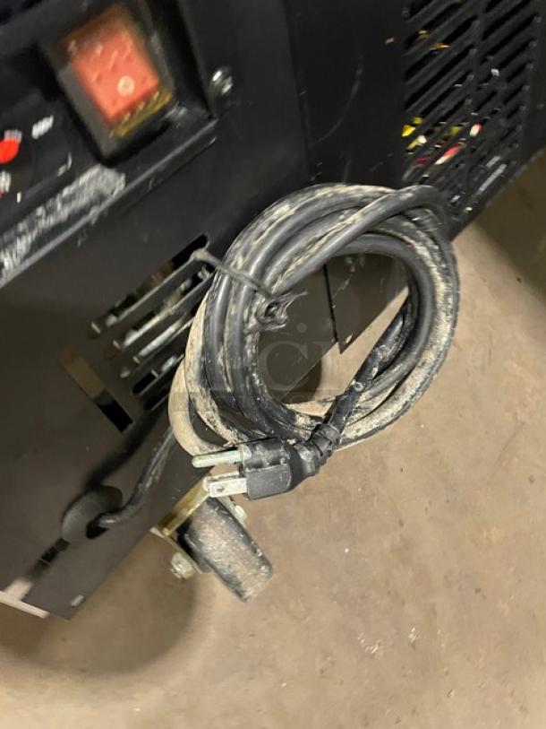 Avantco Model 178TUC48R undercounter refrigerator power cord detail, showing casters and part of rear vent.