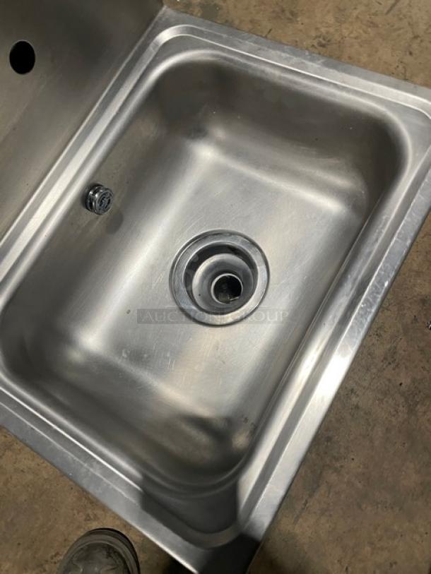 Advance Tabco stainless steel wall-mount single well hand sink with backsplash and built-in paper towel dispenser.