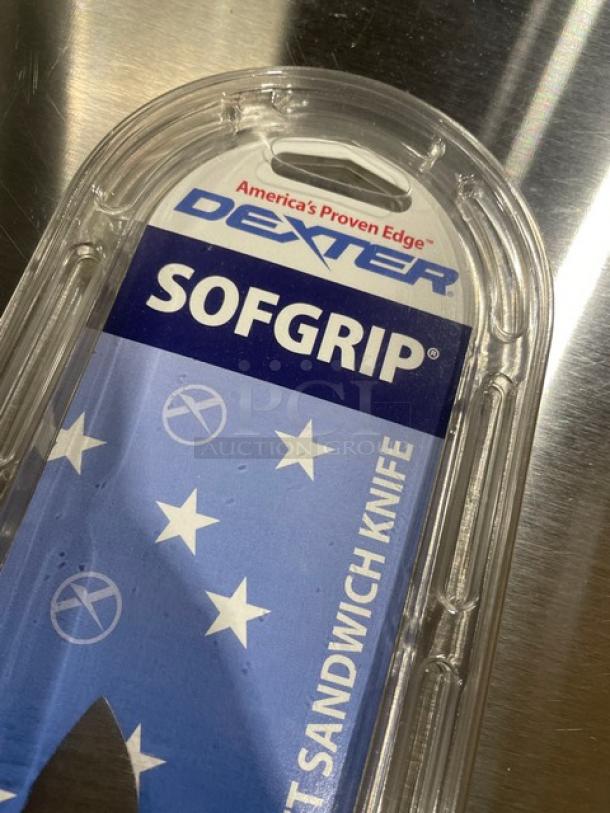 Brand new Dexter Russell Sofgrip Series 9" scalloped offset sandwich knife, model SG163-9SC, with white grip handle.