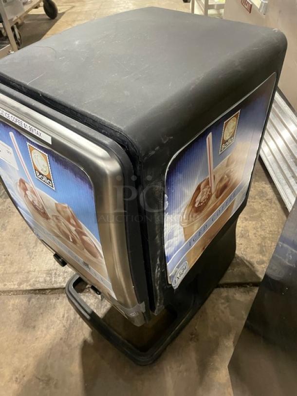 Bolla commercial black electric countertop dual-flavor iced coffee dispenser with stainless steel hopper and push button control.