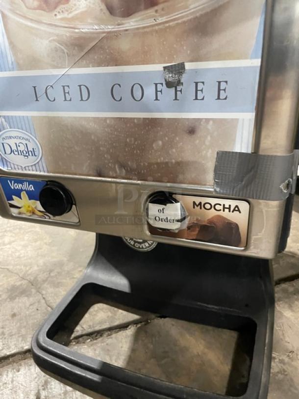 Bolla black electric dual-flavor iced coffee dispenser, vanilla and mocha options, push button control, stainless steel hopper.