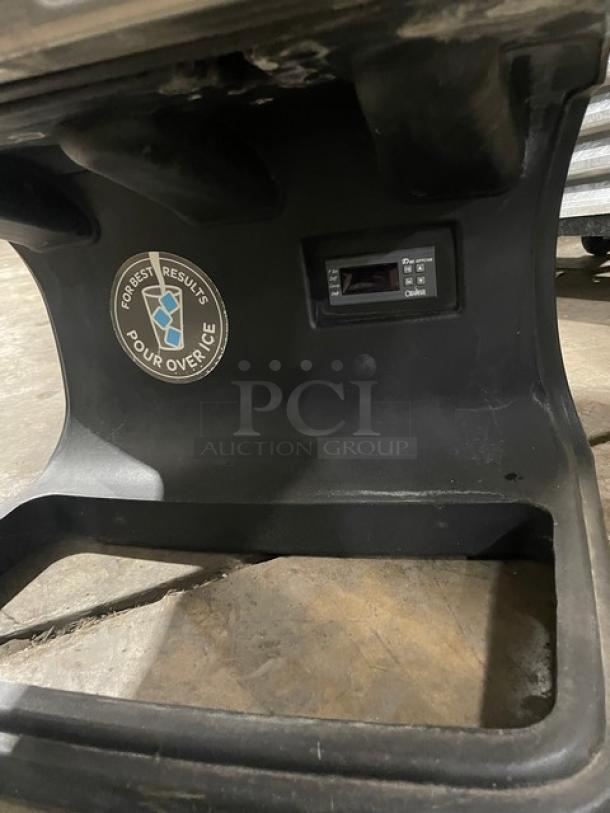 Bolla Commercial Black Dual-Flavor Iced Coffee Dispenser with stainless steel hopper, push button control, and pour over ice instructions.