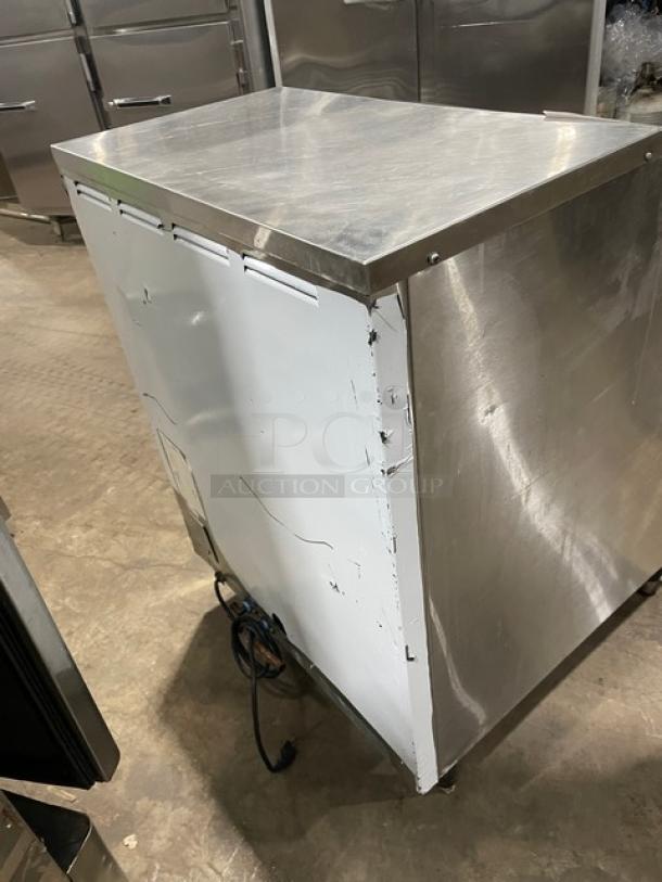 Kold-Draft SC201AC stainless steel ice machine with visible wear. Air-cooled, electric powered, undercounter model on legs.