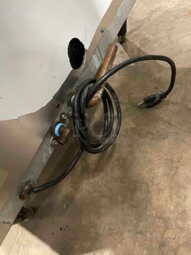 Kold-Draft SC201AC undercounter ice machine, stainless steel, electric, 115V, air-cooled, on legs, coiled power cord visible.