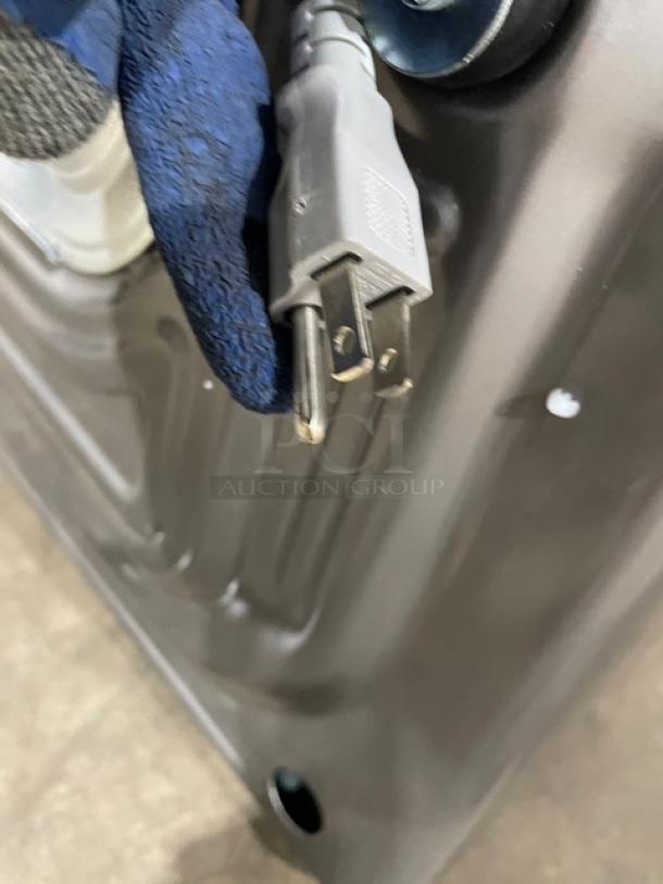 Samsung gray electric front-load washer, model WF45B6300AP, new but scratch-n-dent condition. Power cord visible.