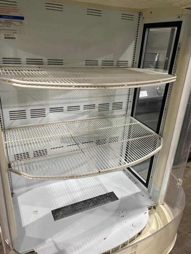 Beverage-Air BZ16GE commercial refrigerated display case with curved design, poly coated wire rack, white interior, SN: 5093717.