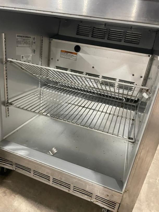 Beverage-Air UCR27 stainless steel undercounter refrigerator with poly-coated rack, model tag visible, on casters.