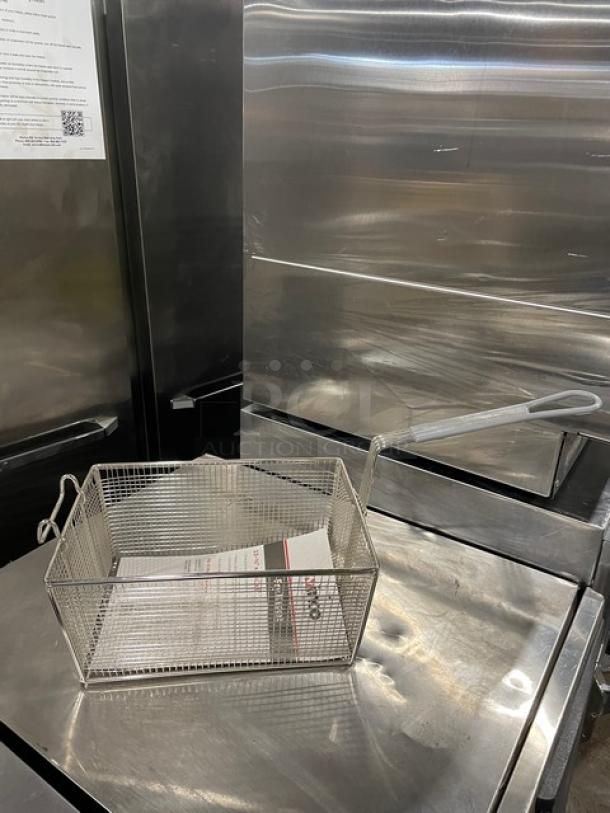 Brand new Winco FB35 commercial mesh deep fry basket, 6" depth, with high-temp resistant coated grip handle, in pristine condition.