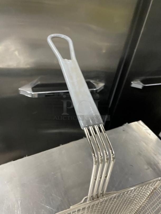 Brand new Winco FB-35 6" deep fry basket with high-temp resistant grip handle, in perfect condition.