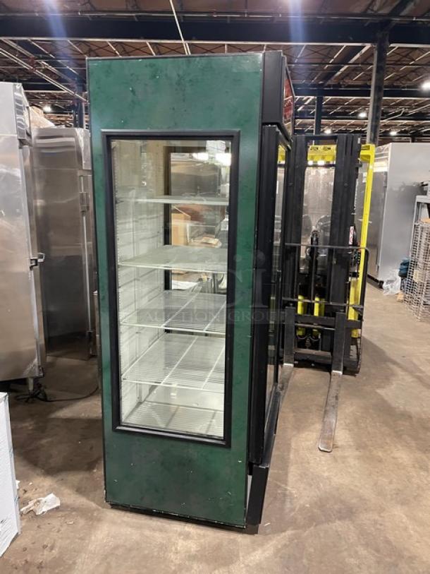 True GEM-23 glass door merchandiser, black, poly coated wires, Energy Star certified, model GEM-23, SN 7259029, 115V, single phase.