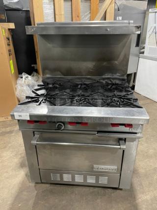 Garland Commercial Stainless Steel Natural Gas Powered 6 Burner Range/Oven Combo! With Back Splash & Overhead Salamander Shelf! With Wired Oven Rack! On Casters! - Item #1217237