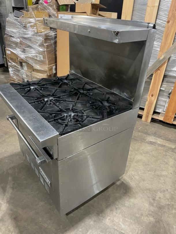 Garland stainless steel natural gas 6-burner range/oven combo with backsplash, overhead salamander shelf, wired oven rack, on casters.