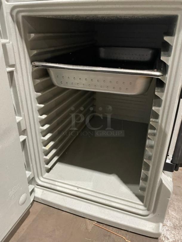 Cambro Ultra Series speckled gray front-loading insulated hot box for food pans, showcasing interior with a shelf.
