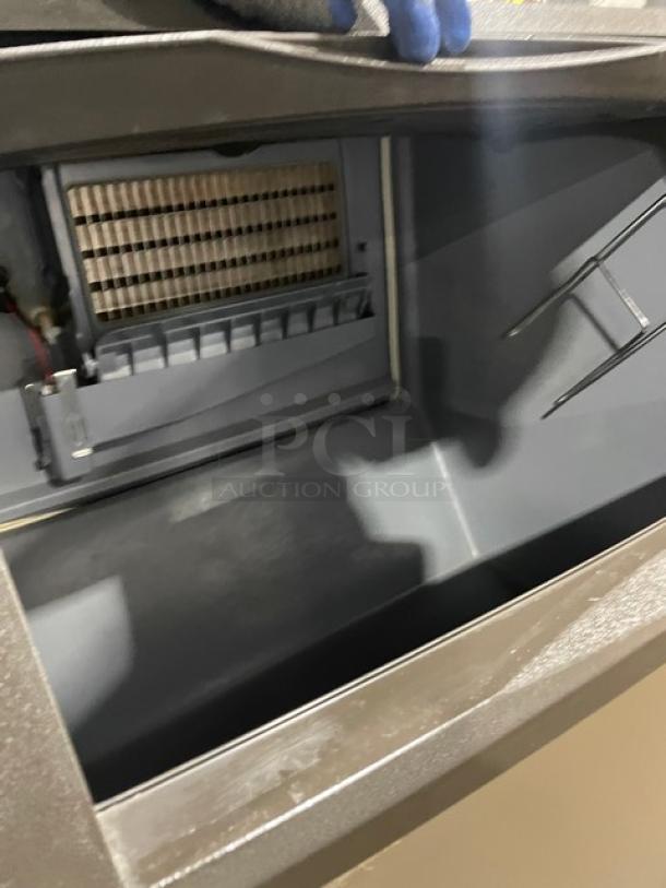 Manitowoc NEO Series stainless steel ice maker, model UYF0140A161B, features air-cooled undercounter design, 115V, single phase, on legs.