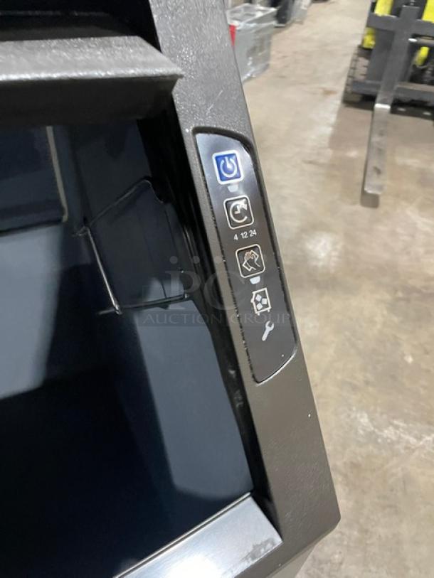 Manitowoc NEO UYF0140A161B ice machine, stainless steel, air-cooled, on legs. Control panel with power and setting icons.