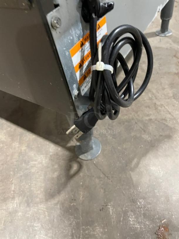 Manitowoc NEO Series UYF0140A-161B ice maker; stainless steel, air-cooled, half-dice cubes, electric, on legs, 115V.