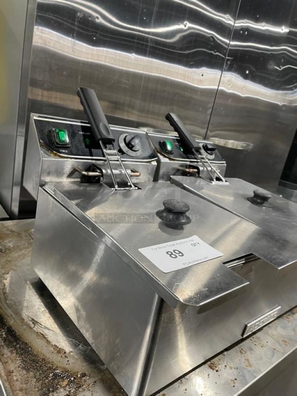 Adcraft DF6L2 dual-tank stainless steel electric countertop fryer with knobbed lid, mesh fry basket, and 120V power.