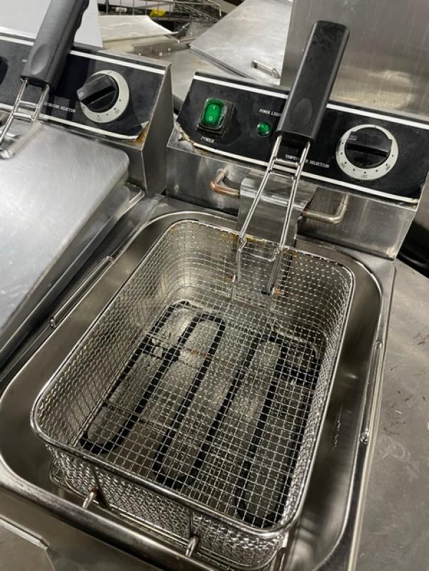 Adcraft DF6L2 dual-tank fryer with mesh basket and knobbed lid. Stainless steel, 120V, model DF-6L/2.
