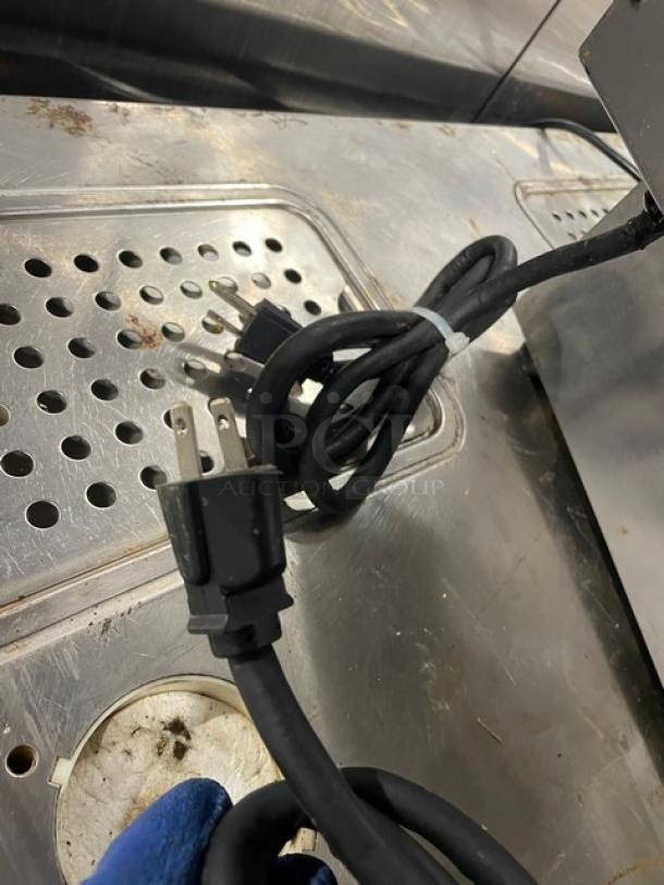 Adcraft DF-6L/2 stainless steel dual-tank fryer with power cord on metal surface, showing wear. Model DF6L2, 120V.