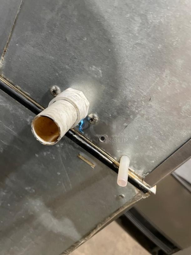 Hoshizaki stainless steel ice machine head/bin combo, model KM-515MAH, showing external tubing connection.