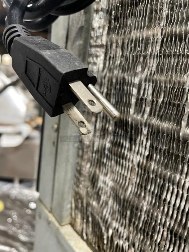 Hoshizaki KM-515MAH ice machine power plug close-up, showcasing standard 115V connection. Energy Star certified.