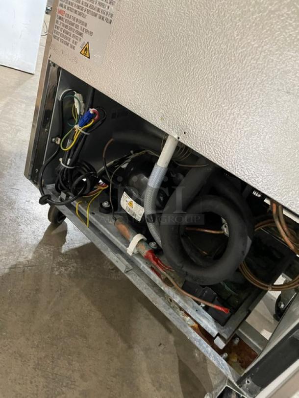 Avantco stainless steel reach-in refrigerator, Model 178A19RHC, features poly-coated wire rack, visible wiring, on casters, 115V.