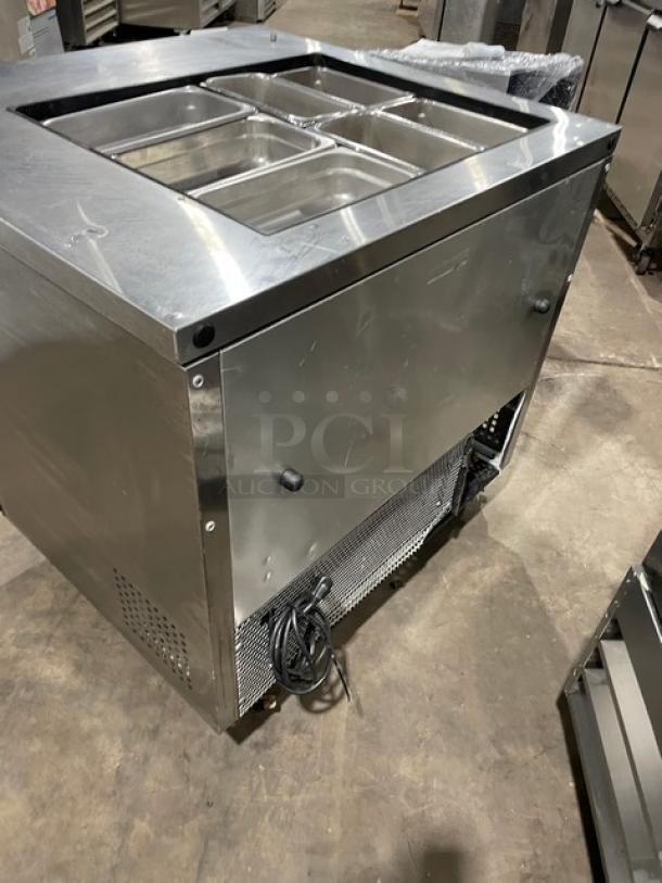 True TSSU-36-12M-B refrigerated prep table, stainless steel, 2 doors, includes hotel/steamtable pan, on casters, 115V.