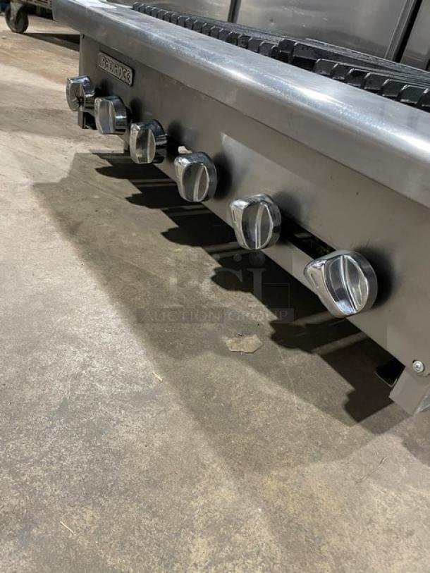 Turbo Air Radiance Series 36" stainless steel char broiler, natural gas, cast iron grates, six control knobs, on legs.