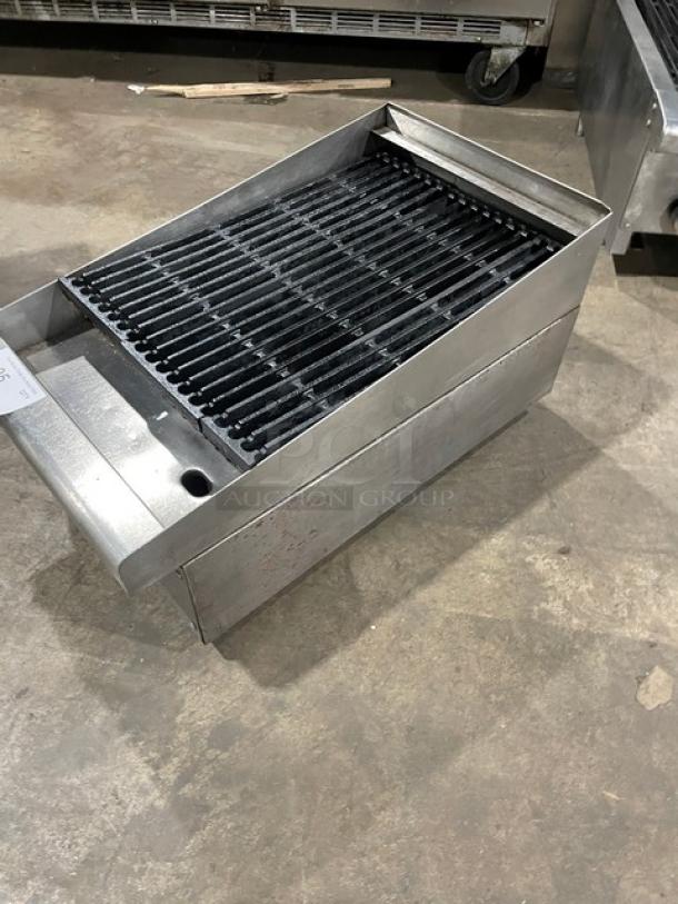 Commercial stainless steel natural gas countertop char broiler with cast iron grate, used condition, visible wear.