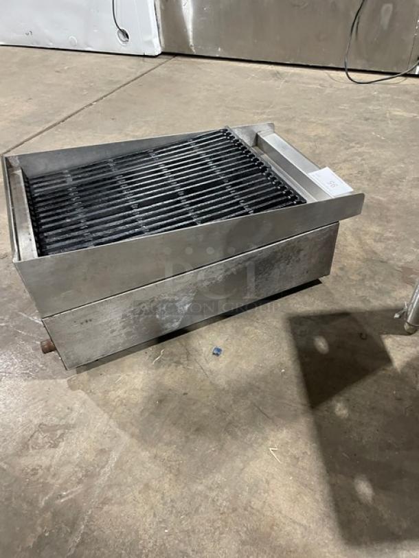 Commercial stainless steel natural gas countertop char broiler with cast iron grate. Used condition. Suitable for professional kitchens.
