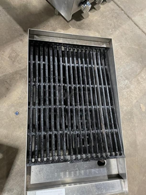 Commercial stainless steel natural gas countertop char broiler with cast iron grate, excellent condition.