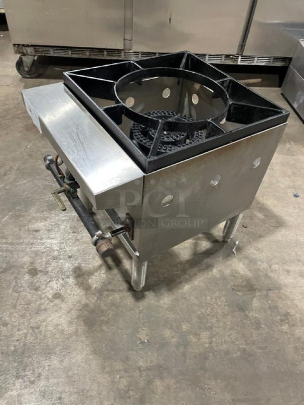 Commercial stainless steel natural gas single burner stock pot range on legs. Durable, with gas connection and sturdy frame.