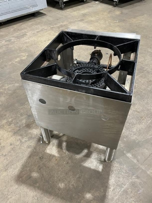 Commercial stainless steel natural gas single burner stock pot range on legs, sturdy construction, visible gas line connection.