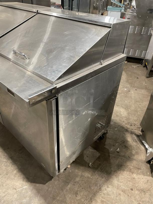 Turbo Air MST-60-24-N stainless steel prep table with two doors, poly-coated rack, 115V, on casters; commercial use.