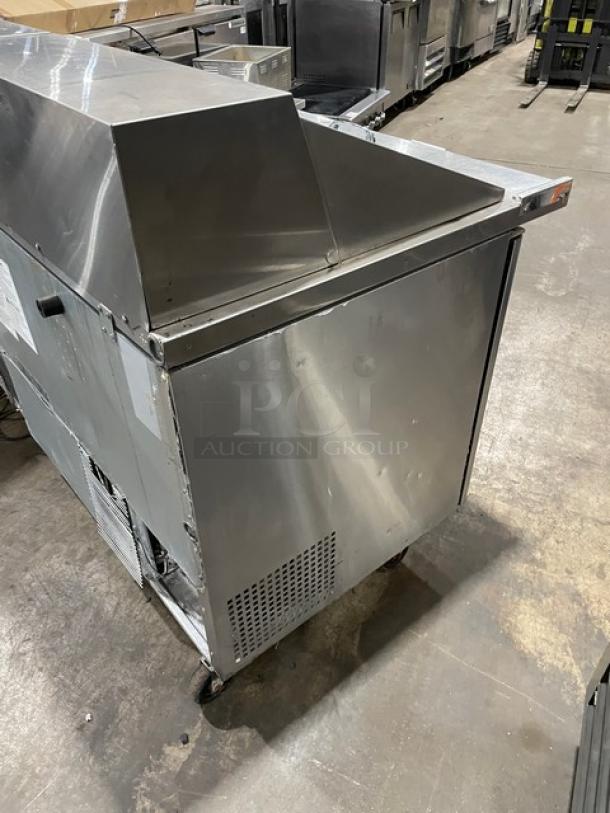 Turbo Air M3 Series 2-door refrigerated prep table, model MST-60-24-N, with casters. Stainless steel, poly-coated rack.