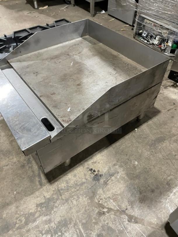 Comstock-Castle stainless steel countertop 2-burner griddle with back and side splash, model FHP3624, natural gas, on legs.