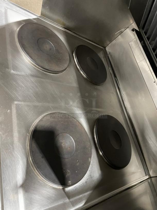 Wells VCS2000 stainless steel ventless cooking system with 4 French hot plates and convection oven base. Includes Ansal system, rear casters, and front legs.