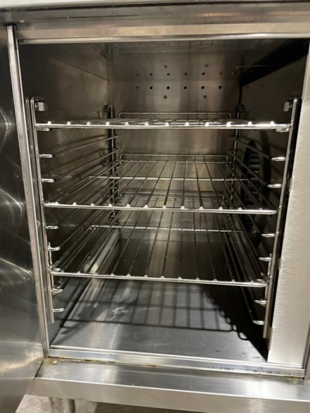 Wells VCS2000 ventless cooking system with wired oven rack, stainless steel, 4-hot plate range, and convection oven base.