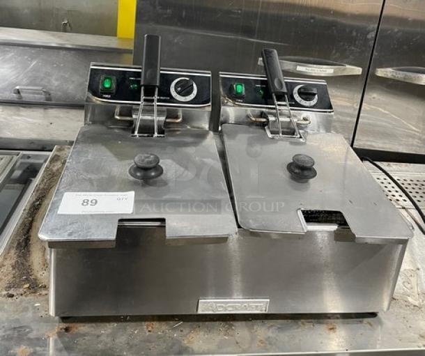 Adcraft DF6L2 stainless steel dual-tank 6L fryer, electric, with knobbed lid, mesh baskets, and visible controls, model DF-6L/2.
