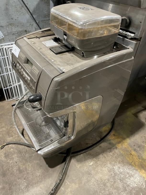 LaCimbali commercial espresso machine with stainless steel steam wand, drip tray, and clear bean hopper. In used condition.