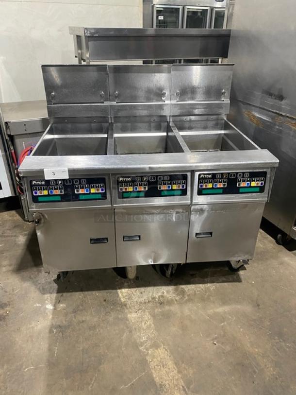 Pitco SSH60 commercial stainless steel 50 lb. triple-bay fryer with backsplash, basket hanger, and casters. Model: SSH60.