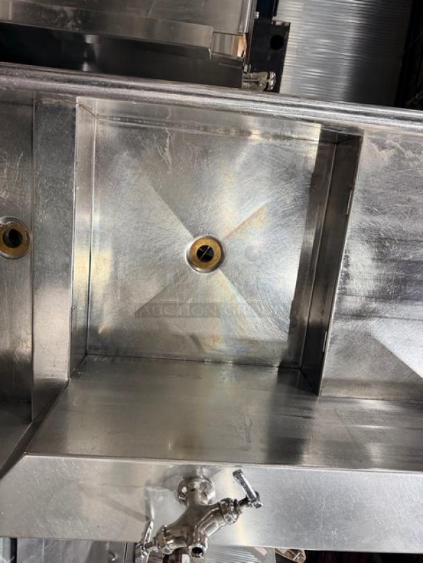 Jackson commercial stainless steel dishwashing machine, door-type, electric powered, with L-shaped station, on legs.