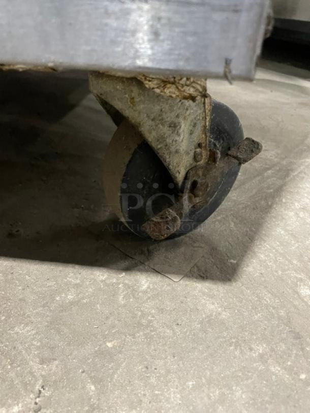 Rusty caster wheel of the Imperial stainless steel range/oven combo. 