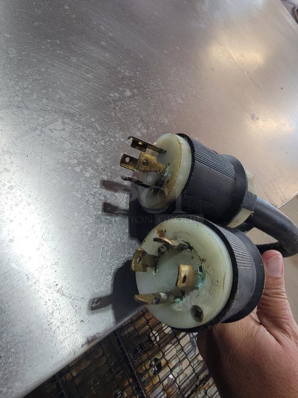 Worn electrical plugs from Middleby Marshall CTX DZ33T oven, showing signs of corrosion. Condition indicates need for maintenance.